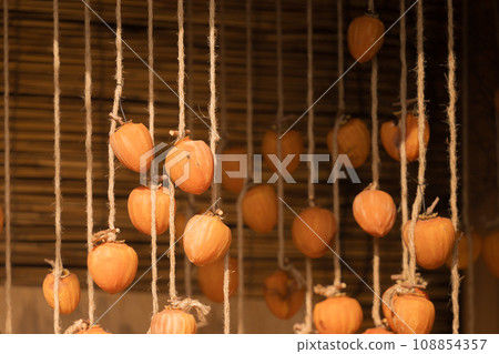 Hanging persimmons, dried persimmons Hanging persimmons, dried persimmons 108854357