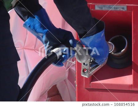 A refueling truck refueling a portable generator A refueling truck refueling a portable generator 108854516