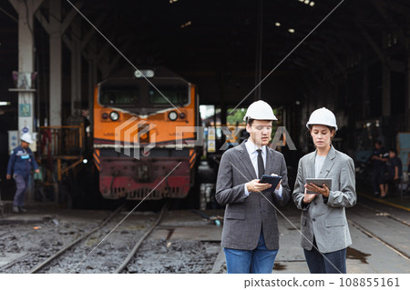 business investor engineer team working survey at site outdoor old locomotive depot diesel train yard plan for renovate 108855161