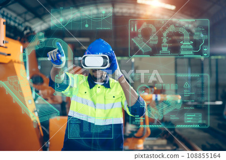 Engineer use VR virtual reality technology control operate robot machine in modern factory new innovation in engineering industry Engineer use VR virtual reality technology control operate robot machine in modern factory new innovation in engineering industry 108855164