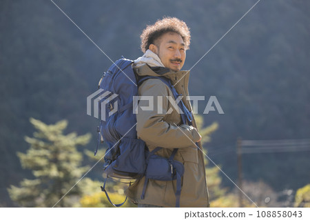 Image of a man walking in the mountains, mountain climbing, etc. 108858043