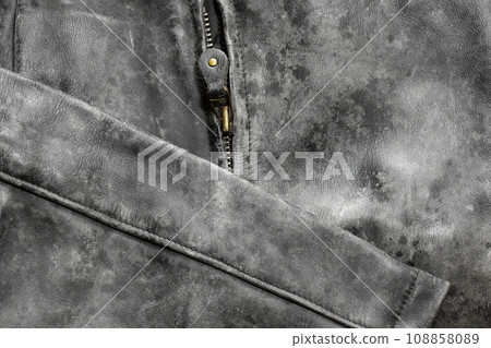 A leather jacket with mold growing on it 108858089