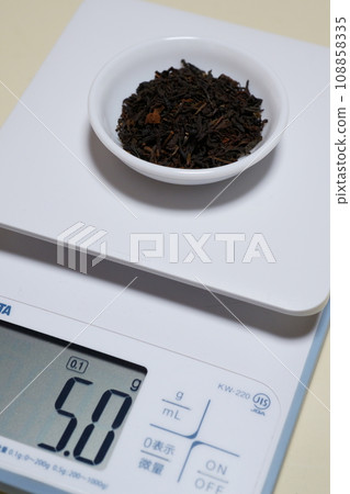 black tea leaves on kitchen scale 108858335