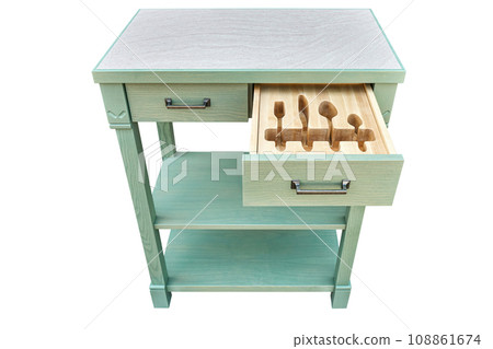 Craved wooden holders for cutlery in serving table drawer 108861674