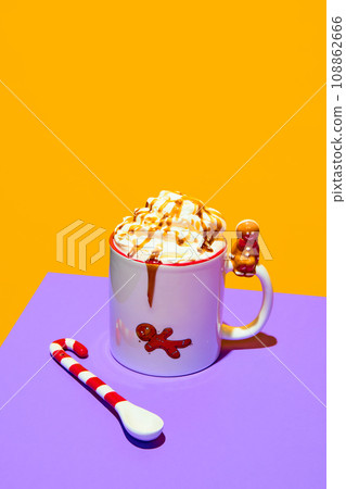 Mug with delicious sweet drink, coffee, hot chocolate with whipped cream and caramel against purple yellow background. Poster 108862666