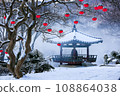 pink paper lanterns and snow on the tree 108864038