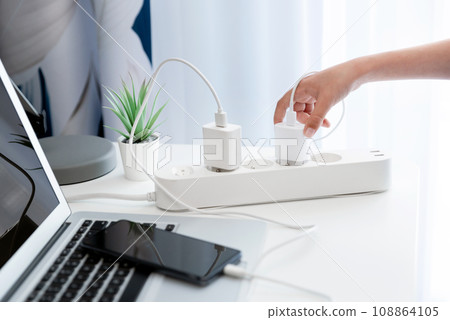 Electrical plug in outlet socket at home 108864105