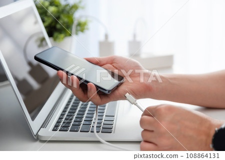 Smartphone charging at home 108864131