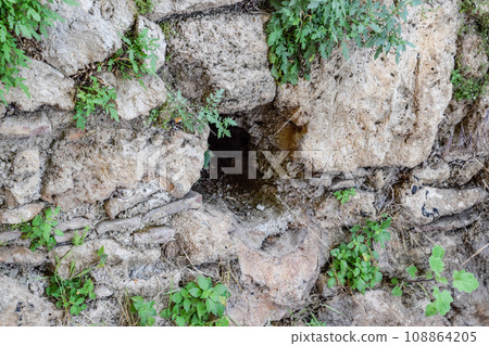 Hole in the wall of limestone Hole in the wall of limestone 108864205