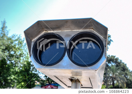 Inspection binoculars on the waterfront. 108864223