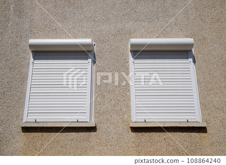 External blinds on the windows for protection from the sun's rays. 108864240
