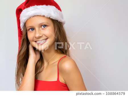 Christmas portrait portrait, smiling white girl wearing a Santa Claus hat, AI-generated image 108864379
