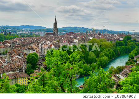 View of Bern old town cityscape with old buildings Bern Minster cathedral tower and Aare river view, Bern is capital of Switzerland View of Bern old town cityscape with old buildings Bern Minster cathedral tower and Aare river view, Bern is capital of Switzerland 108864908