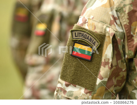 Lithuania patch flag on soldiers arm. Lithuanian military uniform. Lithuania troops Lithuania patch flag on soldiers arm. Lithuanian military uniform. Lithuania troops 108866276