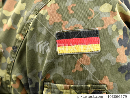Flag of Germany on soldiers arm. Germany military uniform. Army of Germany Flag of Germany on soldiers arm. Germany military uniform. Army of Germany 108866279