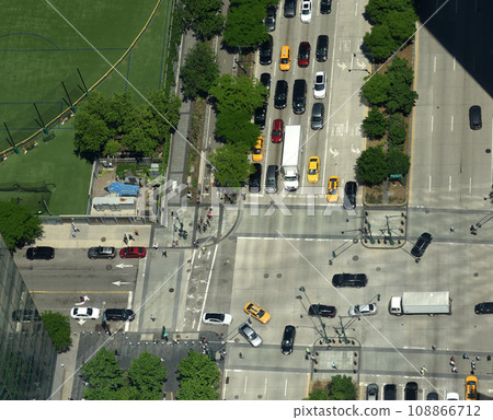 View from skyscrapers on the streets of New York City. Top view on the street with cars on the road 108866712