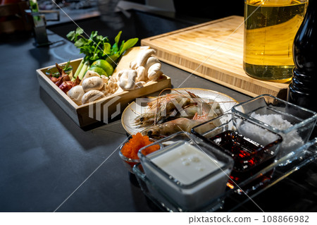 Cooking ingredient, lime, mushroom, shallot, lemon grass, onion, chilli, tobiko, bergamot, shrimp and cheese in wood box plate. They are ready for meal cooking. Cooking ingredient, lime, mushroom, shallot, lemon grass, onion, chilli, tobiko, bergamot, shrimp and cheese in wood box plate. They are ready for meal cooking. 108866982