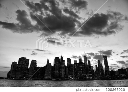 New York cityscape. New York City, financial district in lower Manhattan view from Brooklyn Bridge Park. 108867020