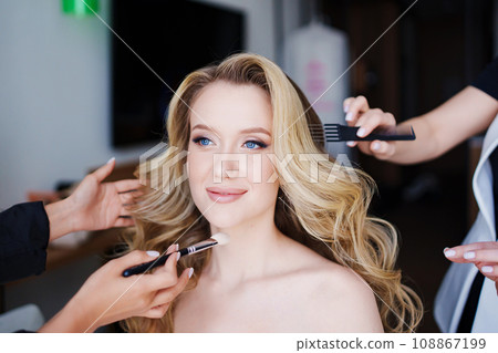 Morning of the bride. Make-up and hair styling for the bride on the wedding day. Morning of the bride. Make-up and hair styling for the bride on the wedding day. 108867199