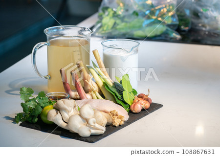 An ingredients set of famous thai soup. The ingredients can be bought at the market, chicken, vegetable, coconut cream, stock soup, herbs together combine as a great dish. An ingredients set of famous thai soup. The ingredients can be bought at the market, chicken, vegetable, coconut cream, stock soup, herbs together combine as a great dish. 108867631