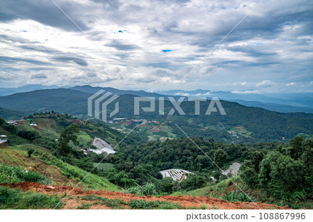 An aerial photographic view of Mon Jam Village in Chiangmai, filled with houses, resorts, and homestays for all the visitors. 108867996
