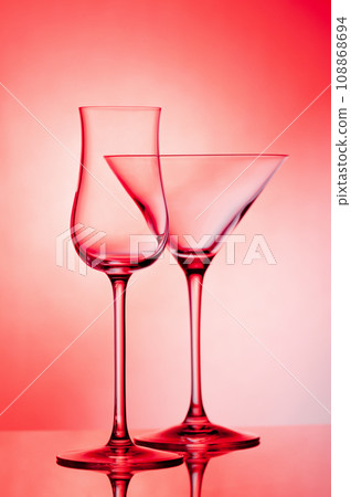 Empty glass wine glass on a red background. 108868694