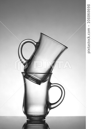 Glasses for tea on a black and white background. 108868698