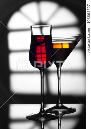 Glass of wine on a black and white background. Glass of wine on a black and white background. 108868707