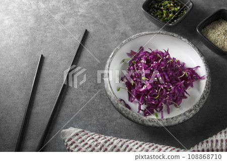 Red cabbage salad with sesame seeds, micro greens and sauce. Red cabbage salad with sesame seeds, micro greens and sauce. 108868710