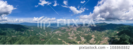 Beautiful panoramic scenery of northern forest, mountain, and clear sky with white clouds in the area of Omkoi district, Chiang Mai, Thailand. Beautiful panoramic scenery of northern forest, mountain, and clear sky with white clouds in the area of Omkoi district, Chiang Mai, Thailand. 108868882