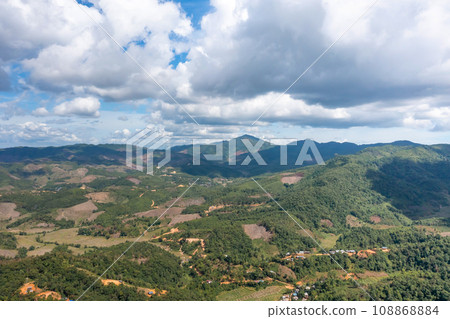 Beautiful panoramic scenery of northern forest, mountain, and clear sky with white clouds in the area of Omkoi district, Chiang Mai, Thailand. Beautiful panoramic scenery of northern forest, mountain, and clear sky with white clouds in the area of Omkoi district, Chiang Mai, Thailand. 108868884