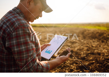 Farmer is checking soil quality before sowing. Agriculture, gardening or ecology concept. 108869352
