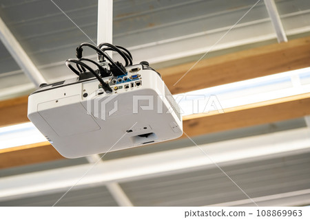 White Projector Hang it on the ceiling in the middle of the meeting room. White Projector Hang it on the ceiling in the middle of the meeting room. 108869963