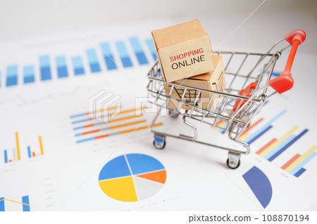 Online shopping, Shopping cart box on business graph, import export, finance commerce. Online shopping, Shopping cart box on business graph, import export, finance commerce. 108870194