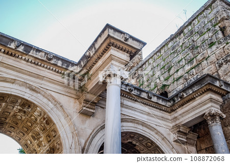 Adrian Gate, Antalya landmark, Turkey. Antique construction of marble and limestone. Adrian Gate, Antalya landmark, Turkey. Antique construction of marble and limestone. 108872068