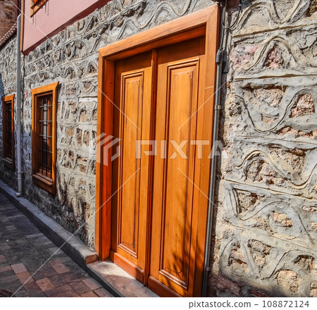 Vintage wooden gate door in old building of the historic town of Kaleici. Vintage wooden gate door in old building of the historic town of Kaleici. 108872124