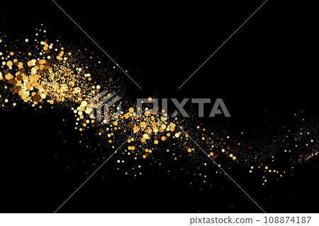 Scattered golden particles on a dark background.Festive background or design element. 108874187