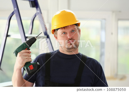 Idiot worker using electric drill portrait Idiot worker using electric drill portrait 108875050