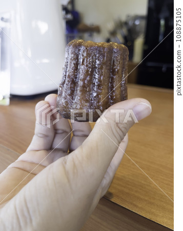 Fresh homemade caneles french pastry Fresh homemade caneles french pastry 108875105