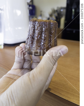 Fresh homemade caneles french pastry Fresh homemade caneles french pastry 108875106