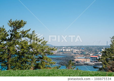 View of seaside village from Seoubong peak in Jeju Island, Korea View of seaside village from Seoubong peak in Jeju Island, Korea 108875534