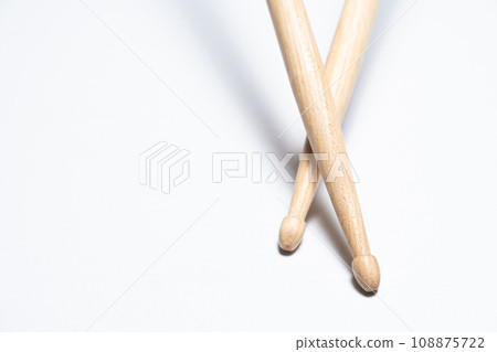 Wooden drum sticks on white background. 108875722