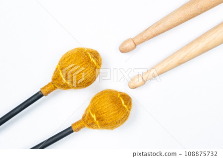 Xylophone and drum sticks on white background top view 108875732