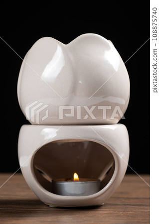 Oil burner aroma lamp, aromatic lamp with essential oils, aromatherapy and relax. Oil burner aroma lamp, aromatic lamp with essential oils, aromatherapy and relax. 108875740
