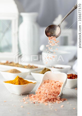 Himalayan pink salt and various spices. Himalayan pink salt and various spices. 108877370