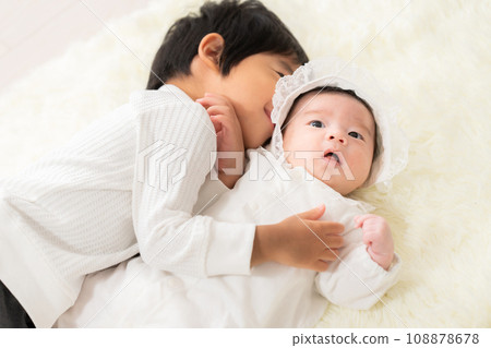 Siblings of a 3 year old and a 1 month old boy 108878678