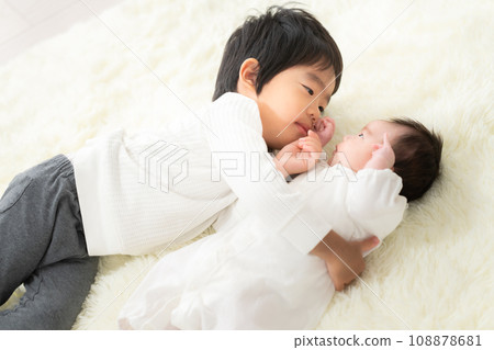 Siblings of a 3 year old and a 1 month old boy 108878681