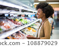 woman african america shopping in supermarket or department store. 108879029