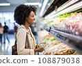woman african america shopping in supermarket or department store. 108879038