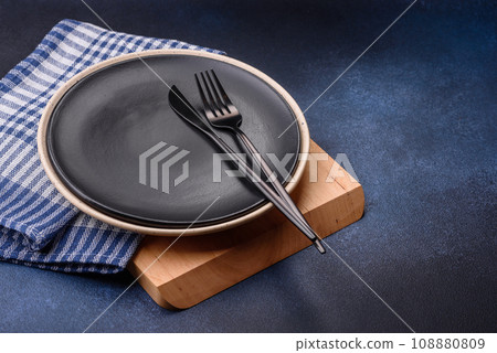 Round empty colored ceramic plate on concrete texture background 108880809